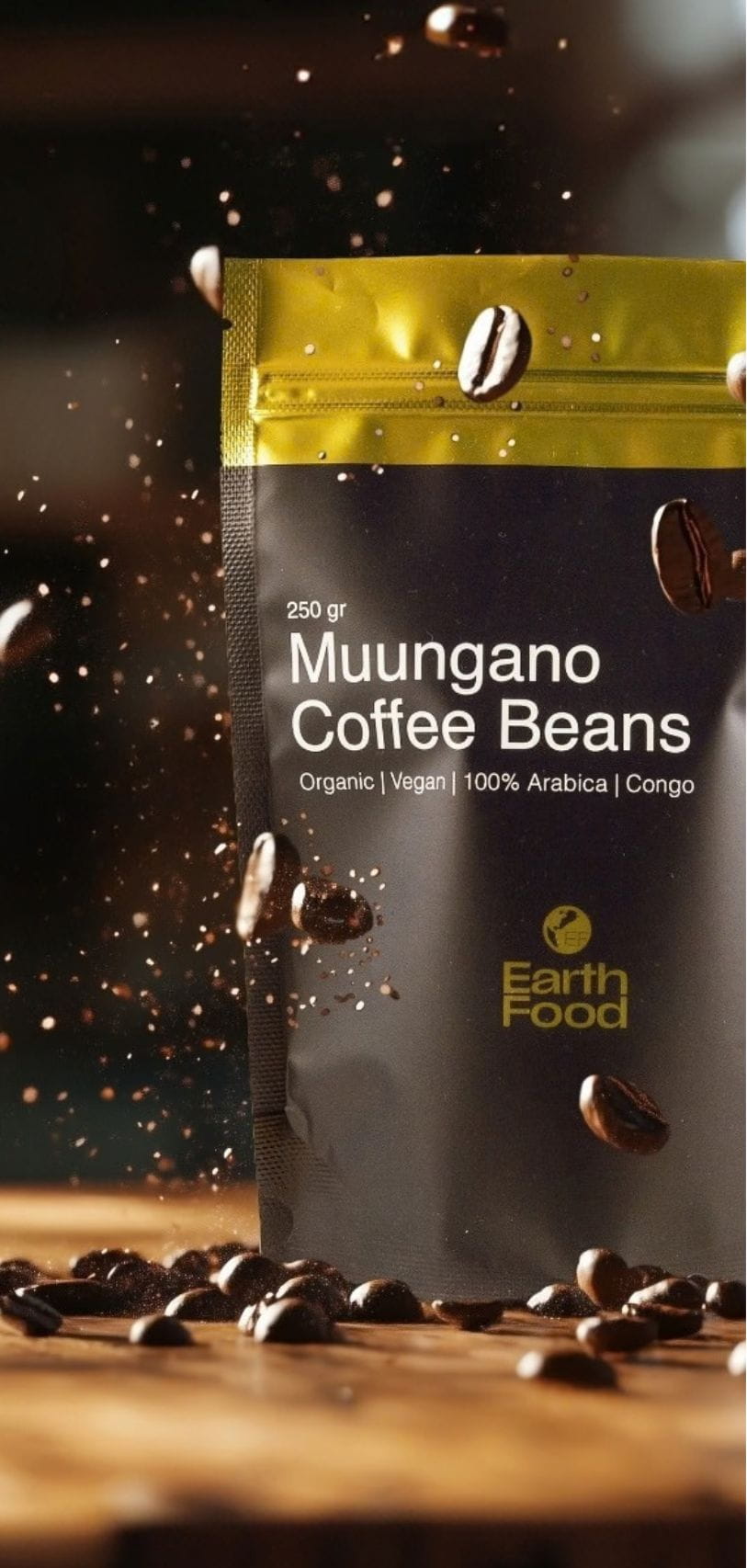 A package of Earth Food Muungano Coffee Beans with visible coffee beans around it. The package is labeled as organic, vegan, and 100% Arabica from Congo.